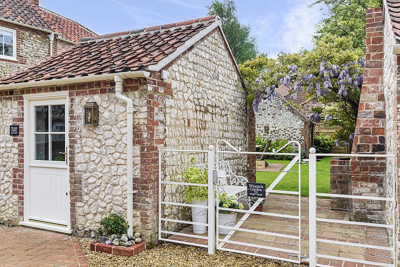 Listed building conservation flint chalk architecture annexe conversion Winearls