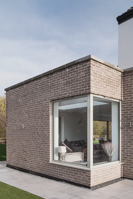 New build house architect Norfolk contemporary timber brick corner window